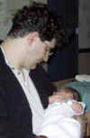 Daddy_with_2-day_old_Lani1.jpg (18130 bytes)